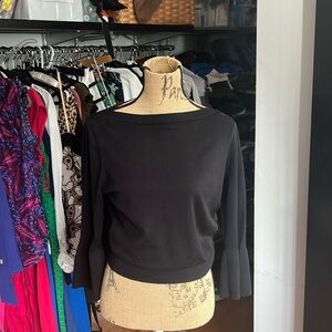 And Taylor knit black size large with bell details at the sleeve great